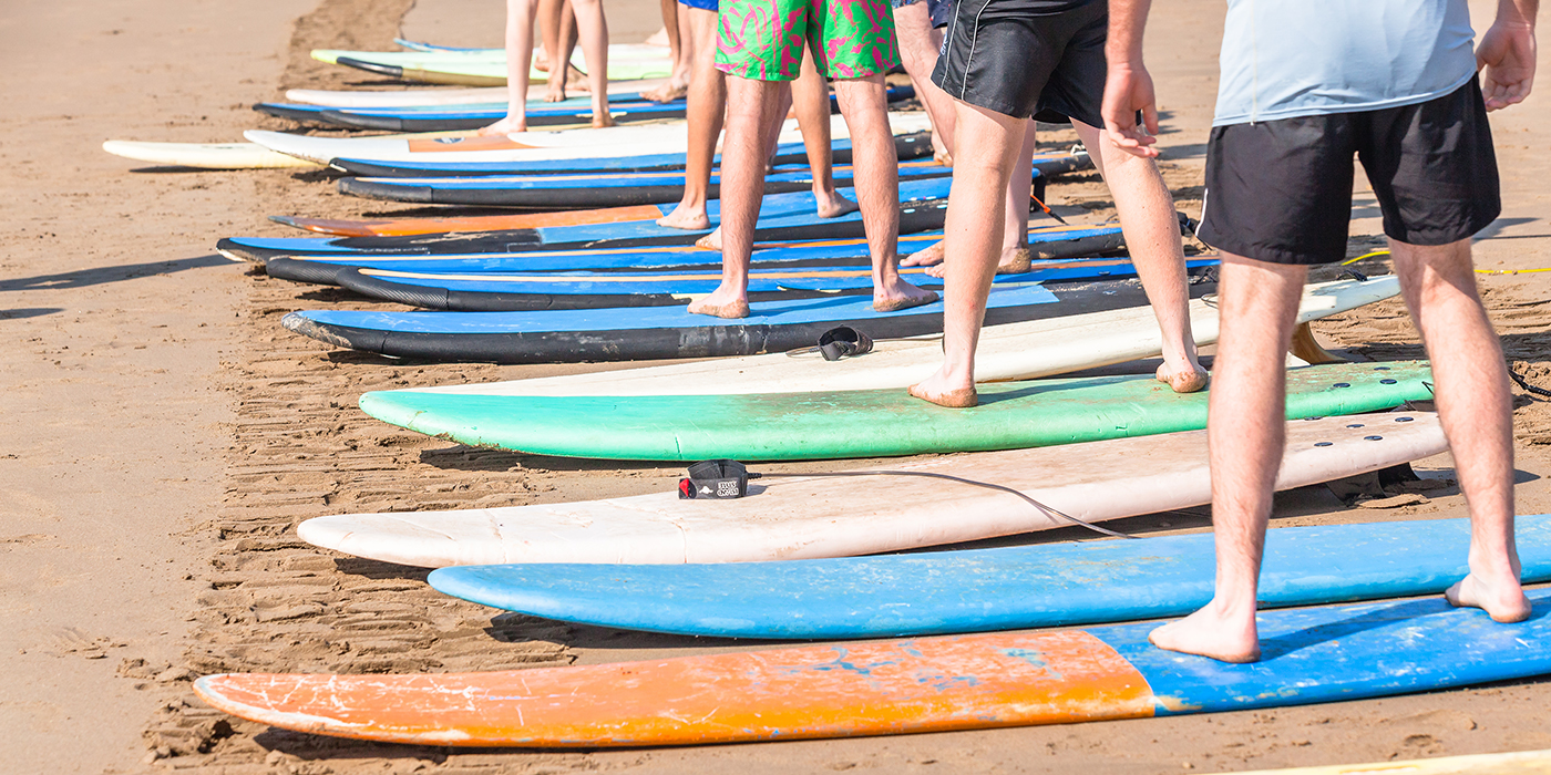 Surfing Lessons Student Legs Surfboards Beach