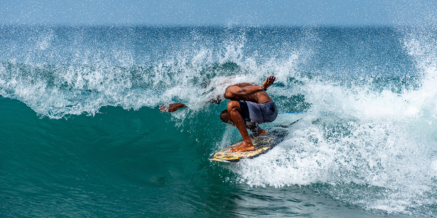 African surfer in a pipeline