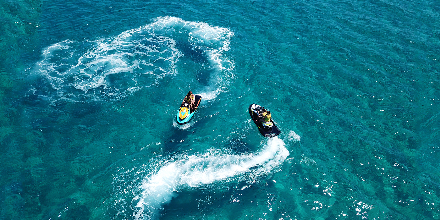 Aerial drone ultra wide photo of jet ski watercraft couple cruis