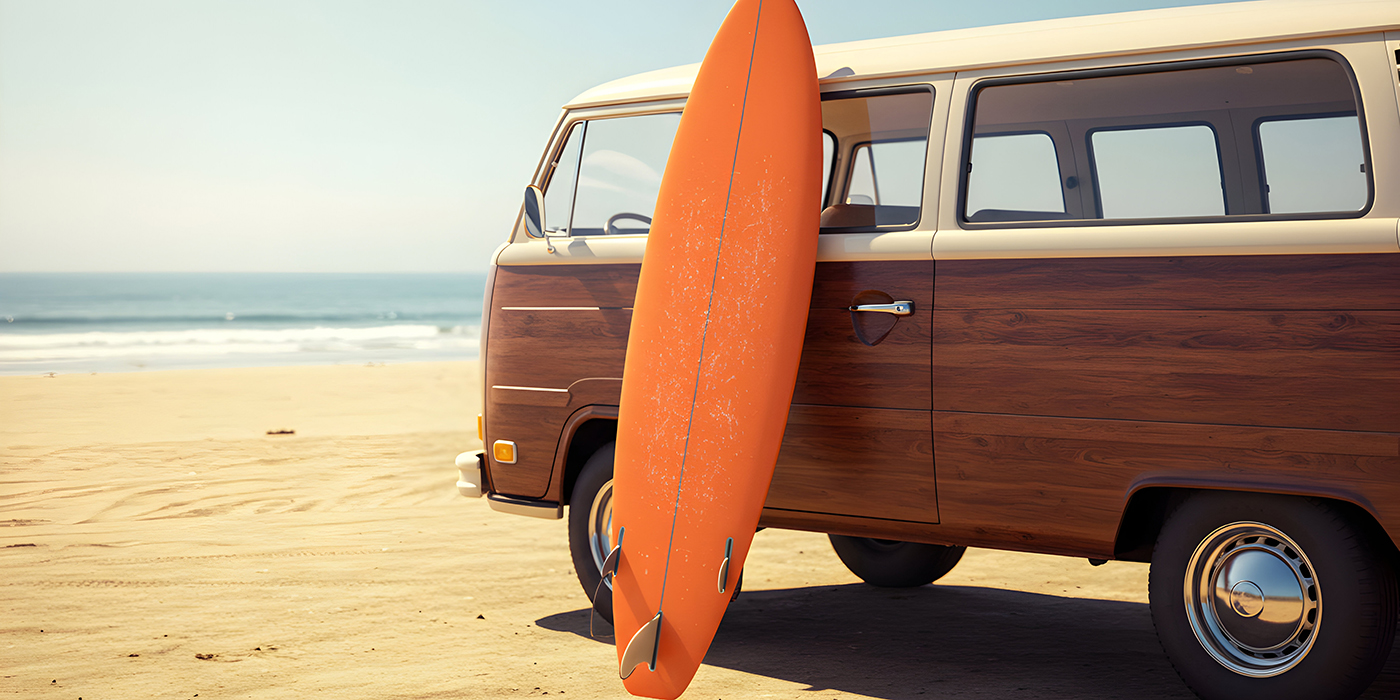 Retro Camper Van On Beach With Surfboard